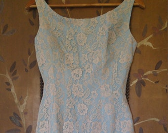 50s light blue and cream lace cocktail dress with ruffled hem and large bow at side