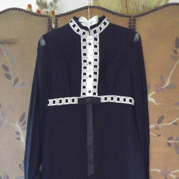 60s black mod mini dress with long sheer sleeves and decorative trim front