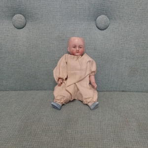1900s Little Antique all bisque mignonette doll with articulated limbs