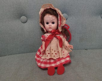 1950s Vogue Ginny walker doll in gingham dress and bonnet