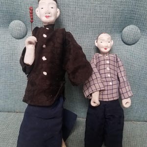 Antique 1900s little Chinese dolls in traditional outfits