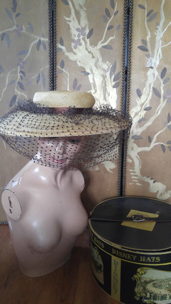 1950's woven wide brim hat with brown net veil and ribbon comes in a  Mr Disney hat box