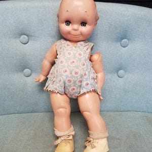 Antique 1920s original Rose O&#39;Neil composition Kewpie doll with sleepy eyes in original clothing, socks and shoes