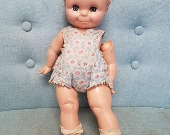 Antique 1920s original Rose O'Neil composition Kewpie doll with sleepy eyes in original clothing, socks and shoes