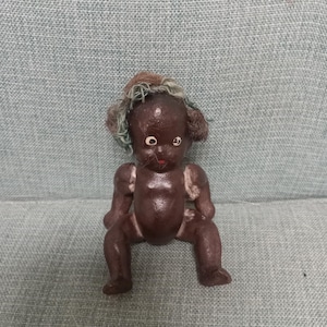 Antique all bisque black baby boy doll with articulated limbs made in Japan