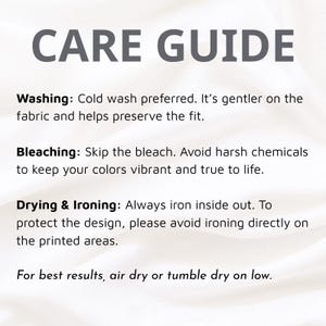 May include: A white care guide graphic with dark gray text. The text reads: CARE GUIDE. Washing: Cold wash preferred. Bleaching: Skip the bleach. Drying & Ironing: Always iron inside out. Avoid ironing directly on printed areas. Air or tumble dry low.