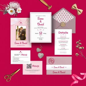 May include: A selection of wedding stationery in pink and white, including invitations, RSVP cards, and details cards. The invitation features the names "Emma & Daniel" and the date "March 12". A gold bow and scissors are also present.