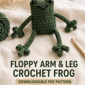 Könnte beinhalten: Ein dunkelgrüner gehäkelter Frosch mit schwarzen Kunststoffaugen und langen, dünnen, schlaffen Armen und Beinen. Der Text lautet: FLOPPY ARM & LEG CROCHET FROG, DOWNLOADABLE PDF PATTERN, DIGITAL DOWNLOAD, INSTANT DOWNLOAD. Ein Knäuel grünes Garn und eine Häkelnadel aus Holz sind zu sehen.