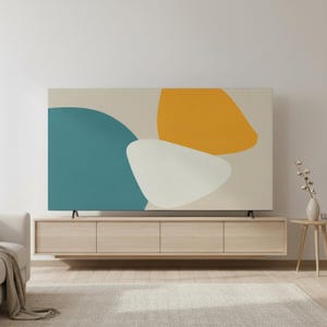 May include: A modern living room featuring a large, abstract art piece with teal, yellow, and white shapes. The artwork is mounted above a light wood floating media console with four drawers. A neutral rug and sofa complete the space.