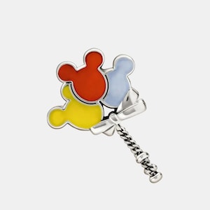 May include: A silver-toned pin featuring three Mickey Mouse head-shaped balloons in red, yellow, and light blue. The balloons are connected to a silver chain and bow.