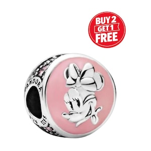 May include: A silver charm with a pink enamel Minnie Mouse design. The charm has the word "Pandora" engraved on the side and the text "Buy 2 Get 1 Free" in a red circle.