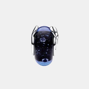 May include: A cylindrical charm bead featuring a dark blue and black glass core with embedded shimmering flecks and air bubbles. The glass center is flanked by polished silver-tone metal caps on both sides, creating a sleek, reflective finish.