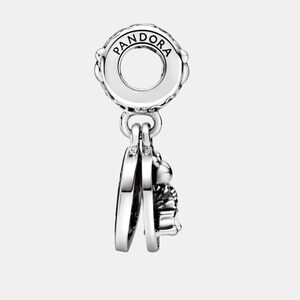 May include: A silver charm with the brand name "PANDORA" engraved on the top. The charm features a circular design with a dangling heart and a small, detailed object, possibly a bee or similar insect.