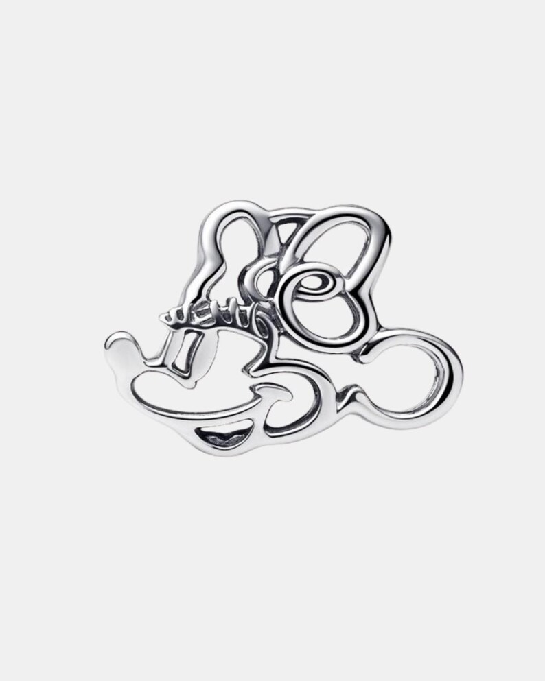May include: A silver-toned charm featuring a stylized Mickey Mouse head and the number 30. The charm has a smooth, polished finish and a whimsical design. The number 30 is integrated into the Mickey Mouse head shape.