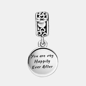 May include: A silver charm with a heart-shaped design and the words "You are my Happily Ever After" engraved on a round pendant. The charm has a decorative top with heart cutouts.