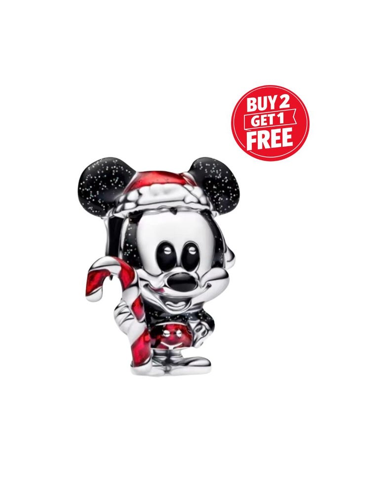 May include: A silver Mickey Mouse charm wearing a Santa hat and holding a candy cane. The charm features black ears with white speckles and a red and white candy cane. A red circle with the text "BUY 2 GET 1 FREE" is also visible.