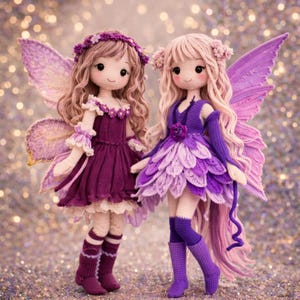 May include: Two handmade crochet fairy dolls. The dolls have long, wavy hair, and are wearing purple dresses with matching wings. One doll has a dark purple dress, and the other has a layered petal-like dress. Both dolls have flower accents.