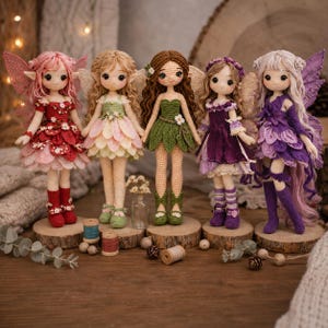 May include: Five handmade crochet fairy dolls with detailed outfits and wings. Each doll stands on a wooden disc. The dolls feature different color schemes, including red, green, pink, and purple, with intricate dress designs and matching boots.