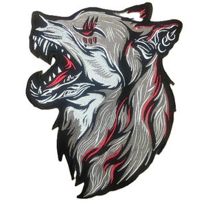 May include: Embroidered patch featuring a detailed wolf head with an open mouth. The design incorporates shades of gray, black, white, and red. The wolf's fur is textured, and the teeth are visible. This patch is suitable for jackets, bags, or other apparel.