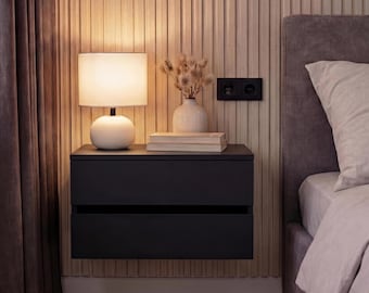 Zwart zwevend nachtkastje met twee lades: wandgemonteerd nachtkastje voor een moderne slaapkamer