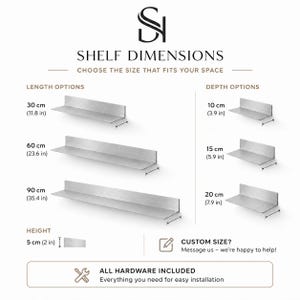 May include: Diagram of metal shelves with dimensions. Length options: 30 cm (11.8 in), 60 cm (23.6 in), and 90 cm (35.4 in). Depth options: 10 cm (3.9 in), 15 cm (5.9 in), and 20 cm (7.9 in). Height: 5 cm (2 in). Text: SHELF DIMENSIONS, ALL HARDWARE INCLUDED.