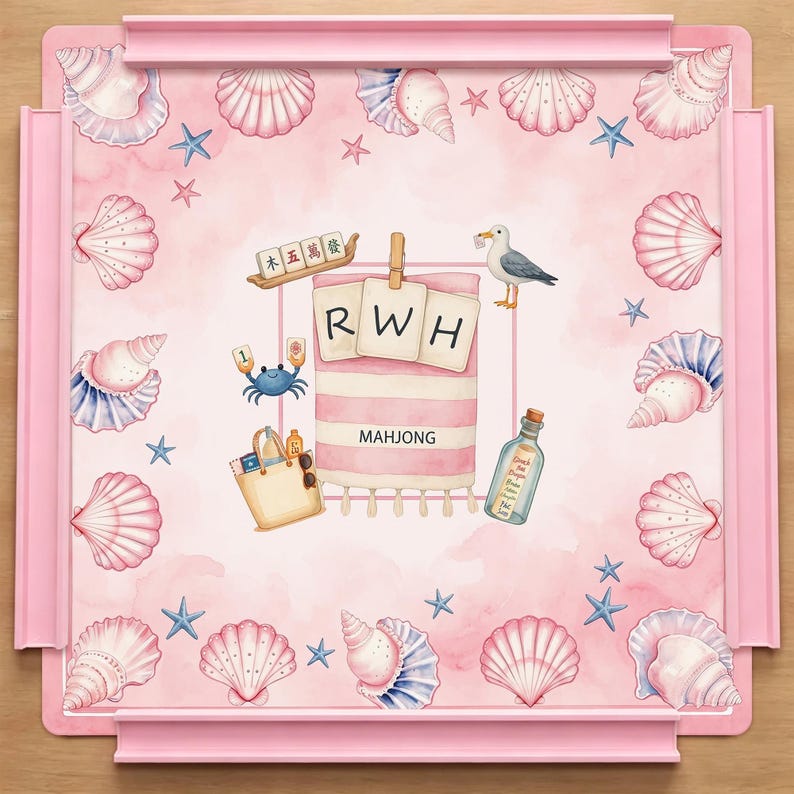 May include: A square pink mahjong mat featuring a border of watercolor seashells and starfish. The center displays a beach towel with the letters RWH, a tote bag, a seagull, a crab, a message in a bottle, and mahjong tiles with Chinese characters.