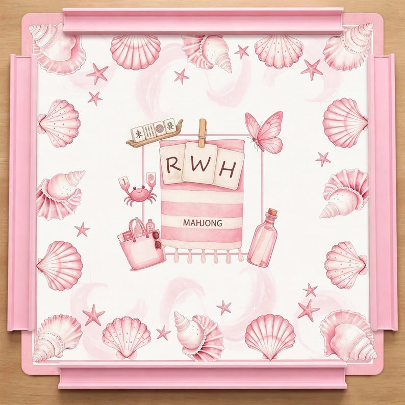 May include: A square pink mahjong tray featuring a white surface decorated with pink seashells, starfish, and a central illustration of a beach towel with the letters RWH, a crab, a tote bag, a butterfly, a glass bottle, and mahjong tiles.