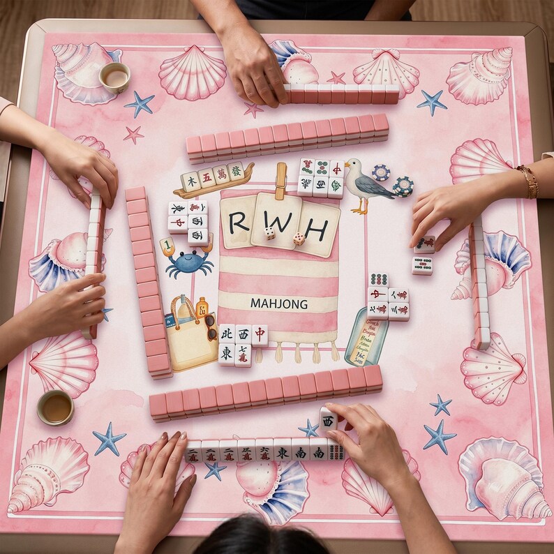 May include: A square mahjong mat with a pink watercolor background featuring illustrations of seashells, starfish, a beach bag, and a seagull. The center displays the text RWH and MAHJONG, surrounded by various mahjong tiles arranged in rows.