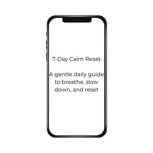 May include: A black smartphone displays the text "7-Day Calm Reset" with the tagline "A gentle daily guide to breathe, slow down, and reset." The phone has a black border and a white screen.