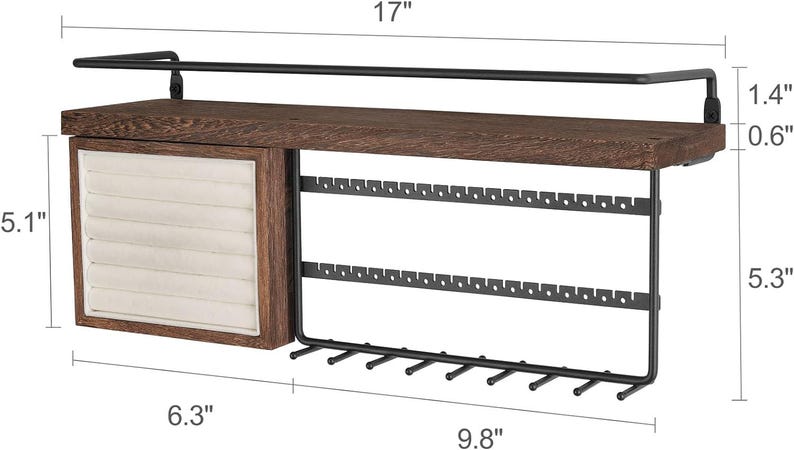 May include: A wooden and metal jewelry organizer. The organizer has a dark brown wooden shelf, a drawer with a cream-colored interior, and a black metal earring and necklace display. The shelf is 17 inches long.