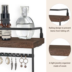 May include: A dark brown wooden shelf with a black metal railing and earring holder. The shelf holds perfume bottles and small brown bottles. The earring holder displays several pairs of earrings. The text in the image says "Railing design to prevent items from falling off."