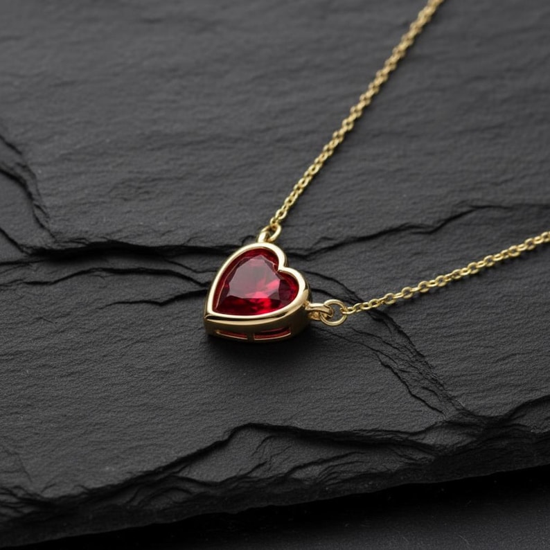 May include: A white ceramic mug with a black handle and the text "But First, Coffee" in a bold, black font. The mug is set against a blurred background, suggesting a cozy setting.