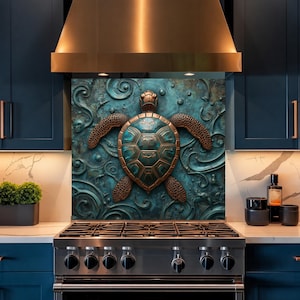 May include: A square kitchen splashback panel featuring a central relief sculpture of a sea turtle in bronze and teal tones. The background displays intricate, swirling, wave-like patterns in a weathered, oxidised metal finish behind the turtle.