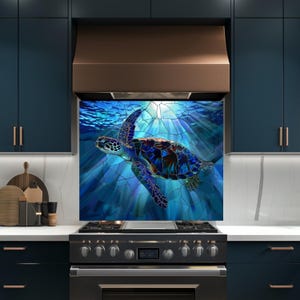 May include: A colourful kitchen splashback depicting a sea turtle in blue waters. The turtle has a mosaic pattern with blue, brown, and green hues. The background shows sunlight filtering through the water, creating a dynamic design. The splashback is a decorative kitchen element.