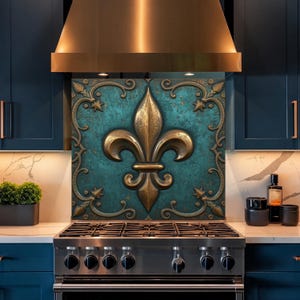May include: A kitchen backsplash featuring a gold fleur-de-lis design on a teal background. The fleur-de-lis is framed by ornate gold scrollwork and stars. The backsplash is installed above a stainless steel gas range.