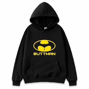 May include: Black hooded sweatshirt with a yellow graphic of a bat-like symbol with a butt shape in the center. The word "BUTTMAN" is printed in yellow below the graphic. The sweatshirt has a front pocket.