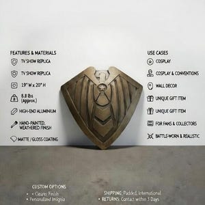 May include: A metallic shield replica from a TV show, hand-painted with a weathered finish. The shield is approximately 19 inches wide by 20 inches high and weighs 8.8 lbs. It is made of high-end aluminum with a matte/gloss coating.