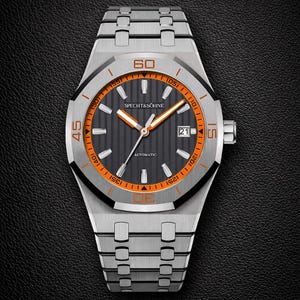 May include: A stainless steel wristwatch with a black and orange face. The watch features the brand name "SPECHT & SÖHNE" and the word "AUTOMATIC". The watch has a date display and a silver band. The watch face has a diameter of approximately 4 cm.