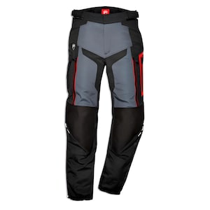 May include: Black and grey motorcycle trousers featuring a high-waisted design with a black waistband, red accents along the zipped pockets, and a small white logo on the upper right thigh. The trousers have reinforced black panels on the lower legs.