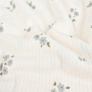 Rib knit fabric detail of Flowers (Article 6075) Dark Old Green with scattered floral pattern on green base