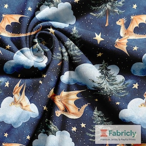 May include: Dark blue fabric with a fantasy design featuring dragons, clouds, stars, and trees. The dragons have orange wings and are flying among the clouds. The fabric has a starry night sky background.