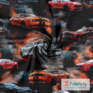 May include: Fabric with a repeating pattern of various sports cars in shades of red, orange, gray, and black. The cars are depicted in a dynamic arrangement, with some appearing to be in motion. The background has blurred orange and black elements.