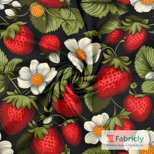 May include: A fabric with a repeating pattern of red strawberries, white flowers with orange centers, and green leaves on a black background. The strawberries are detailed with small seeds, and the flowers have multiple petals.