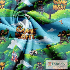 May include: Fabric with a colourful video game-themed design. The fabric features a landscape with archers, robots, controllers, and the words "Game Night" in a pixelated font. The colour palette includes shades of blue, green, and brown.
