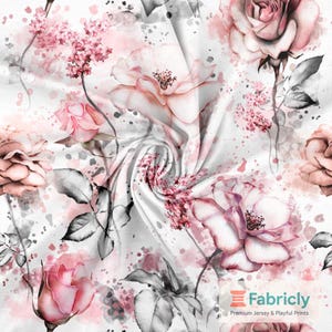 May include: White fabric with a watercolour floral design. The pattern features pink roses, grey leaves, and splatters. The Fabricly logo is in the bottom right corner.