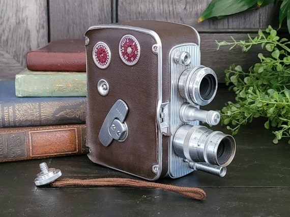 Vintage Bell & Howell Filmo Auto 8 Video Camera With Wrist Vintage Bell & Howell Filmo Auto 8 Video Camera With Wrist
