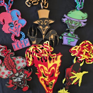 May include: A set of three ceramic mugs with a speckled, matte finish. The mugs are in shades of cream, light gray, and dark gray. Each mug has a simple, minimalist design, perfect for coffee or tea.