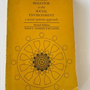 May include: A vintage book titled "HUMAN BEHAVIOR in the SOCIAL ENVIRONMENT" with a yellow cover. The cover features black text and a geometric design. The book is a second edition by Ralph E. Anderson & Irl Carter.