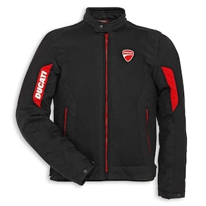 May include: Black motorcycle jacket with red detailing. Includes a red zip, red stripes on the sleeves, and the Ducati logo on the chest. The word "Ducati" is printed in white on the left sleeve.