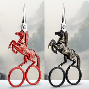 May include: Two pairs of scissors with handles shaped like a rearing horse. One pair is metallic red and the other is metallic black. Both feature silver-colored blades and gold-colored filigree scrollwork patterns on the horse's body.